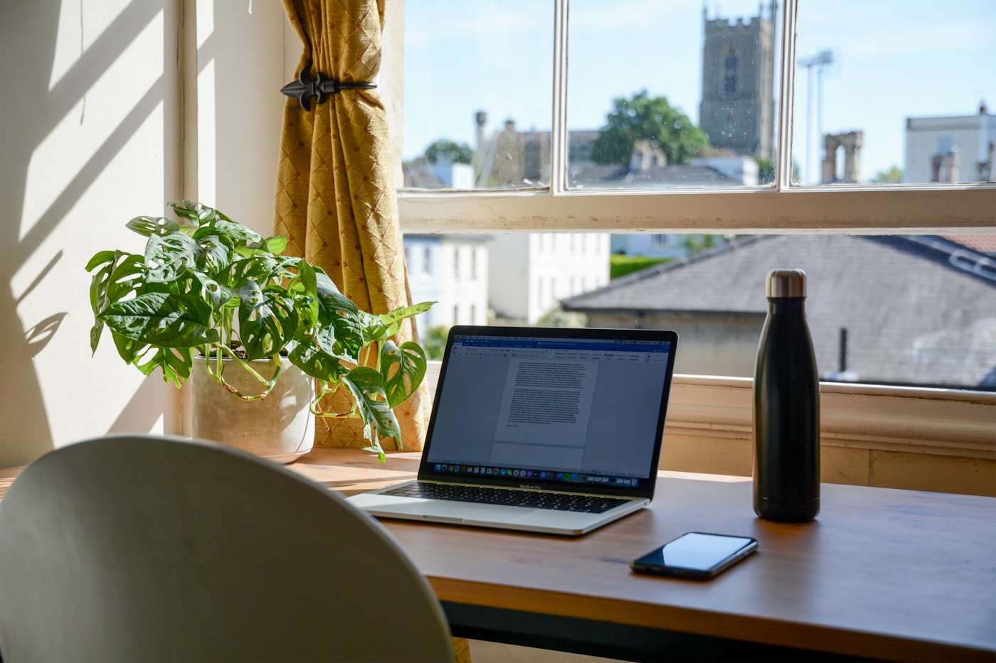 Laptop and phone in a connected home workspace